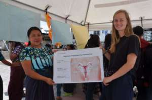 Rebeca and intern Denise at the fair
