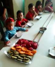 Children at the preschool eating enriched arepas