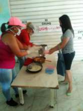 A mother picking up food to bring home