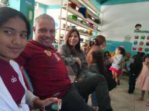 Crala and Jose visiting one school