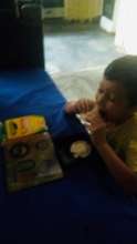 One of of Children having Breakfast