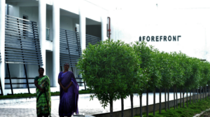 Education leaders in front of school building