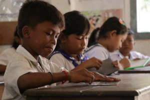 Children concentrating on a lesson at school