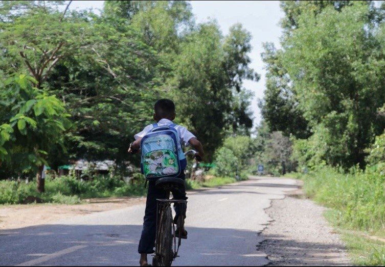 Child cycling to school