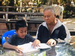 Vannak with his grandfather at home