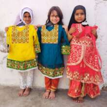 Young Children Receive New Eid Clothes
