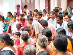 Leader calling family member  to get relief bags