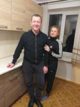 Maria at the dormitory with Sasha,Project Leader
