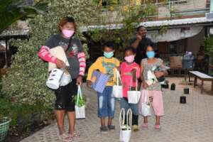 A family receives their herb plants