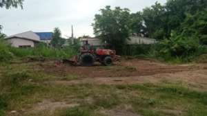 Clearing the land for a new community garden.