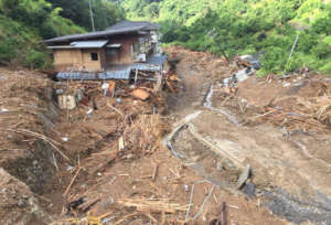 A house buried in mud and road