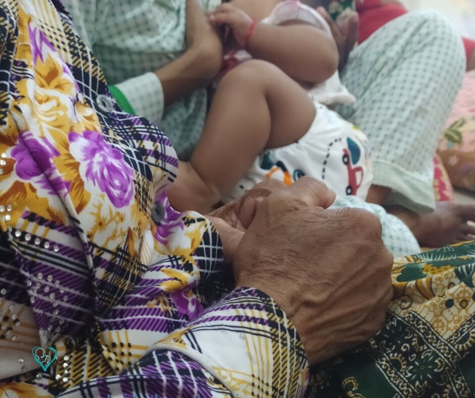 A mother, her baby, and the support of a grandma.