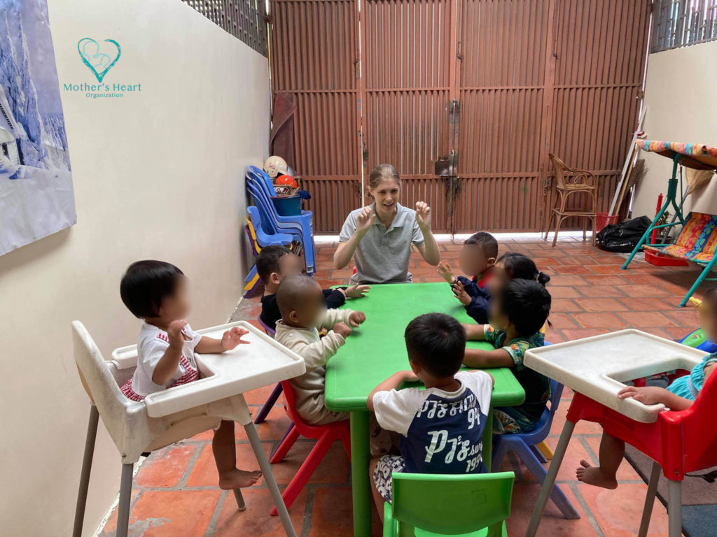 Children in the daycare enjoy listening to a story