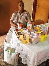 Gogo Mary with the Topsy OVC food parcel