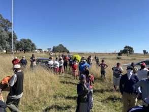Community members waiting to receive food parcels