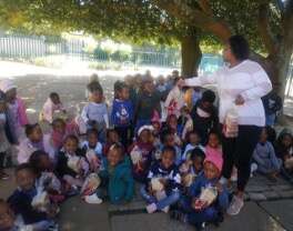 Practitioner handing out bread