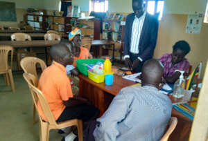 Librarian Lucy recording pupils at school library