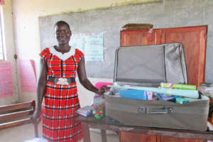 Teacher Irene showing how she stores reading books