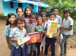 Kids receive school and play supplies