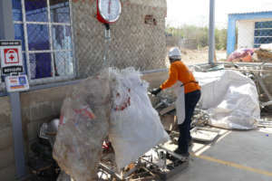 Local recycler working at the storage facility