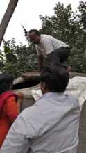 Parents cleaning water tank in school
