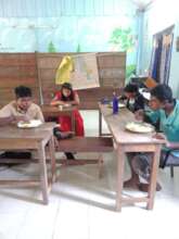Students enjoying mid day meal