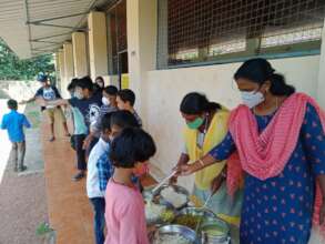 Teachers serving meal