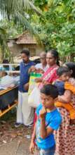 Flood relief material receiving by poor families