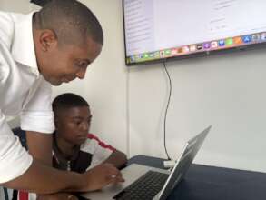 Software Engineer Mentors Child in AI