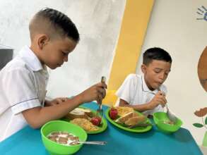 Children Enjoying Breakfast
