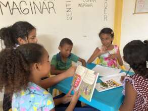 Children Smiling in Reading Activity