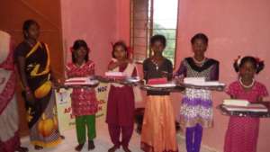 School bag and note books to tribal girls