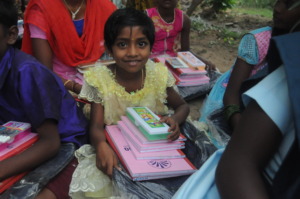 Children are happy with school bag,note books Etc.