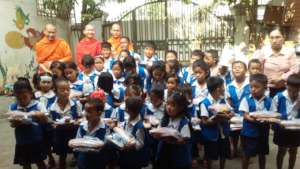 Monks sometimes donate food & books