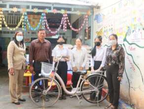 Ropini & her sister receive a bicycle from project