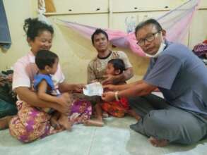 SCC founder, Mr. Thoeun, bring support to the fami