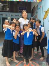 SCC teacher volunteer with her students