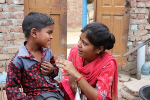 Home Visit:Field officer shares a moment w Priyank