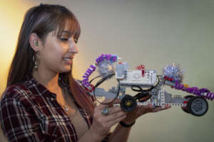 Kimberly proudly shows her robot