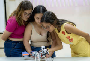 Young women working with their trainer.