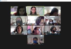 Young women interact with the course facilitators