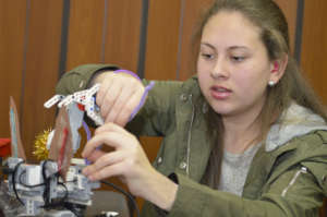Priscilla shows her robot