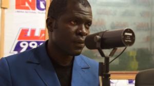 Emmanuel Urey hosts a weekly radio program on land