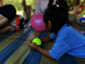 Precious Thida learning fine motor skills.