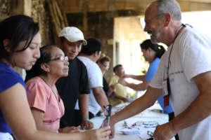 RestoringVision founder, Mark Sachs gives glasses