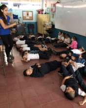 Kids from 15 de Agosto School meditating.