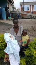 Rosine with her son and newborn baby