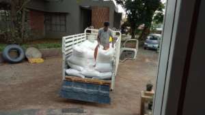 Unloading the fodder at the rescue camp