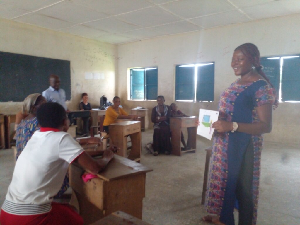 PCEF staff with caregivers on financial education