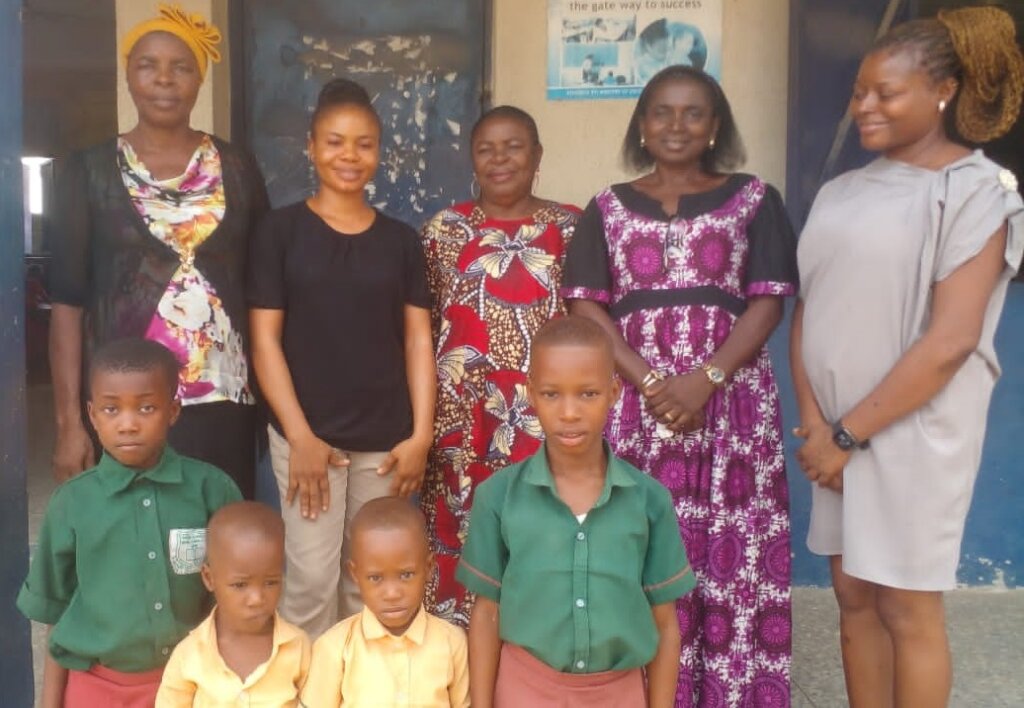 PCEF team with teachers and beneficiaries